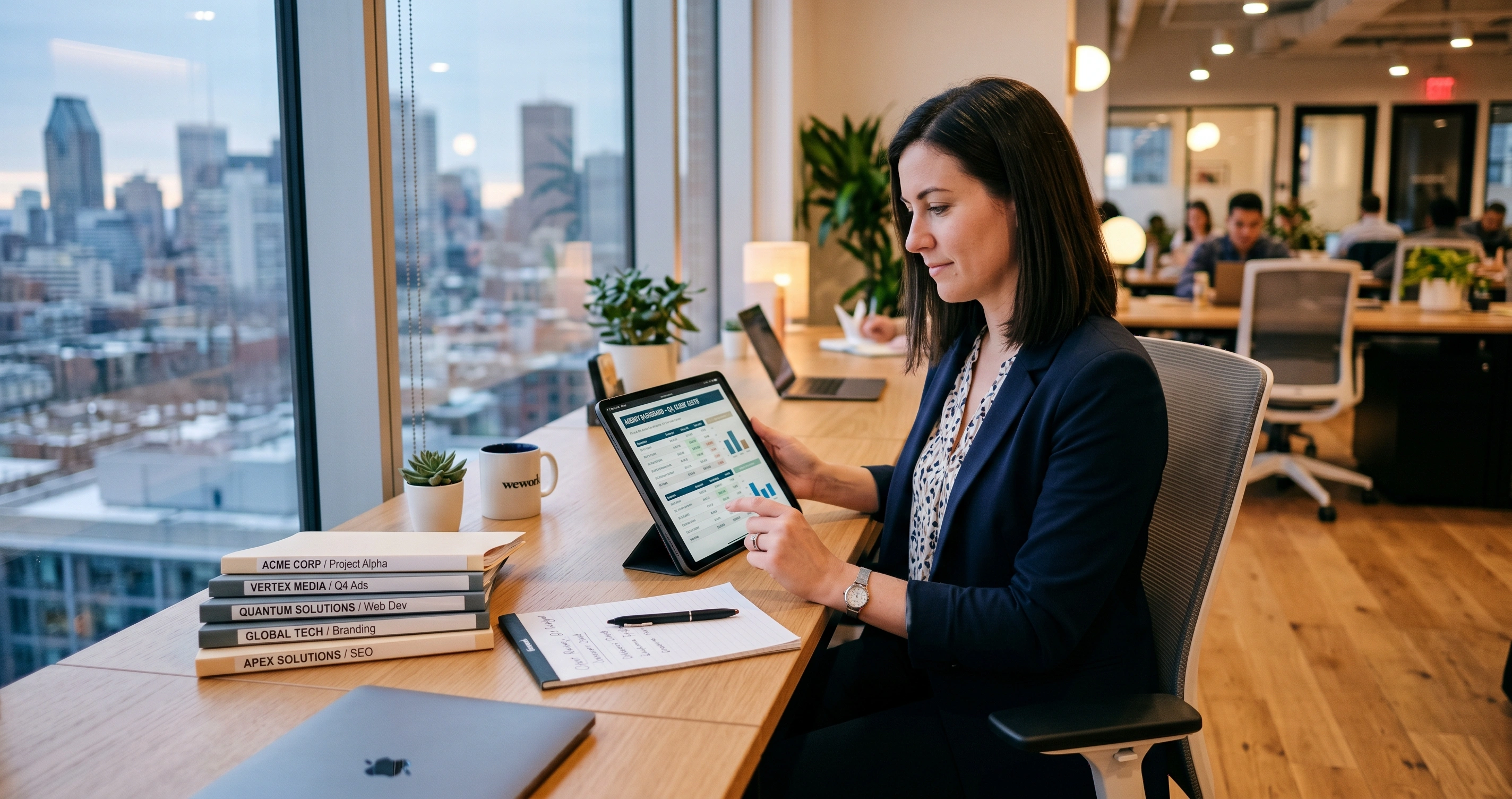 Agency project manager reviewing per-client AI cost breakdowns on a tablet in a sleek co-working space